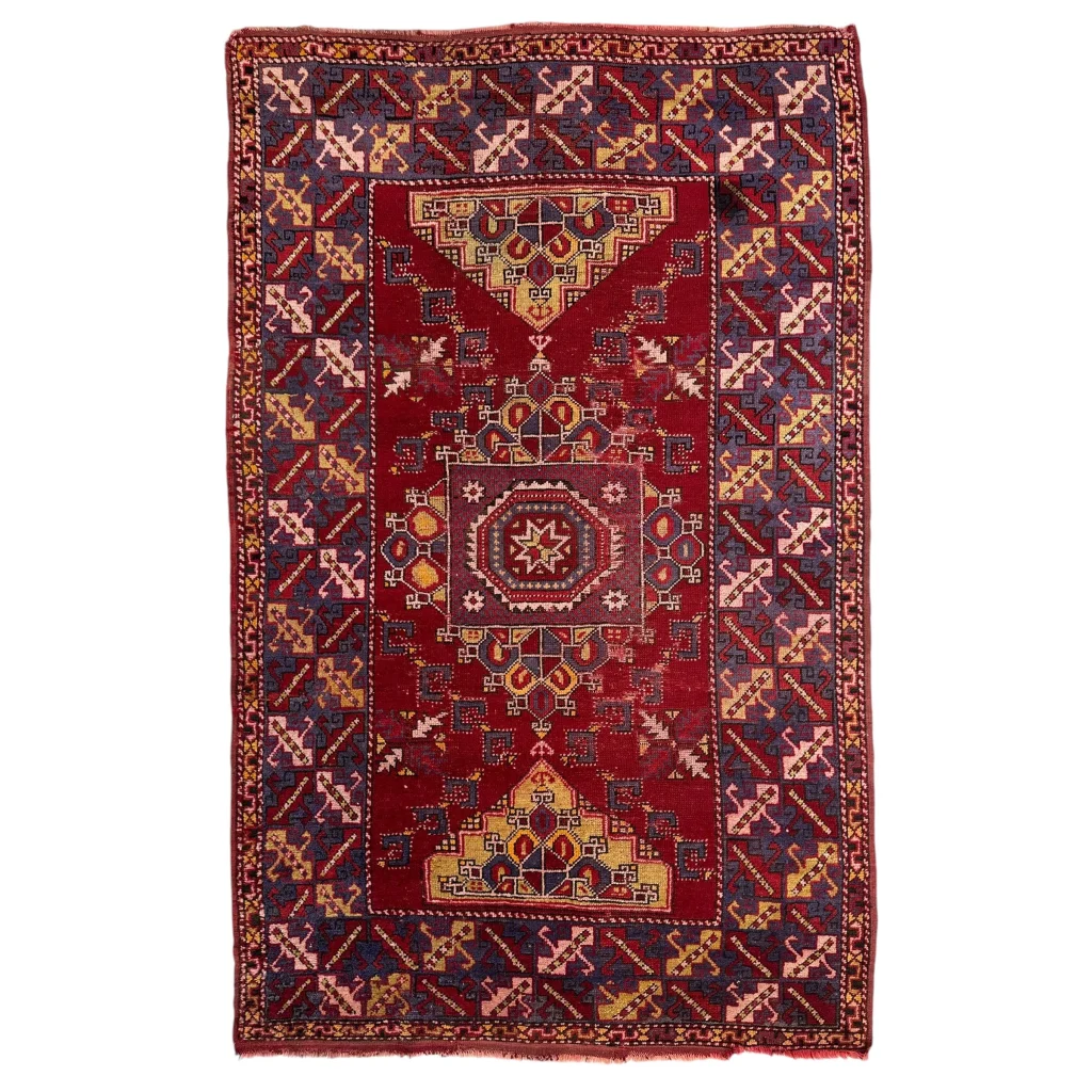 Stunning Anatolian tribal rug with bold red medallion and geometric motifs