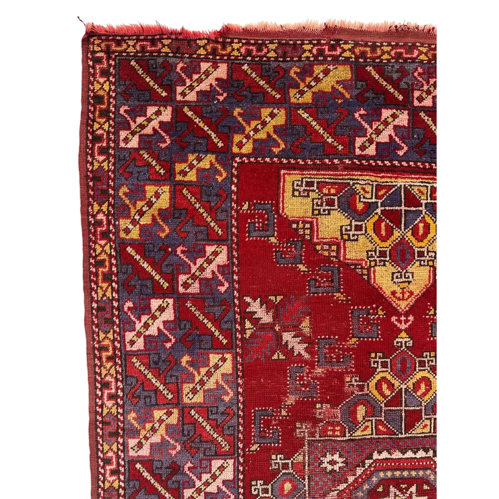 Vibrant Anatolian tribal rug with red gold patterns and bold medallion