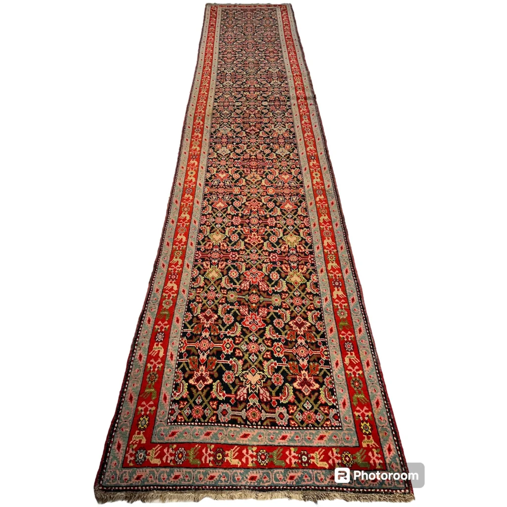 Stunning antique Caucasian wool runner rug in rich reds and golds