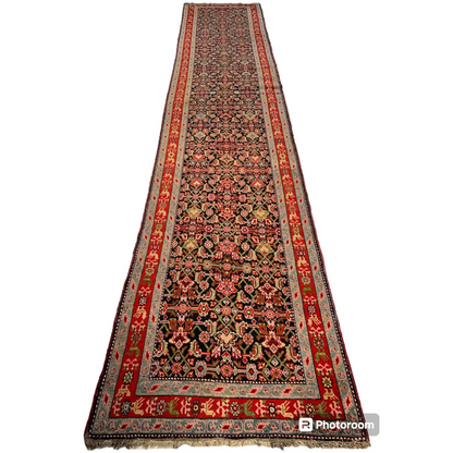 Stunning antique Caucasian wool runner rug in rich reds and golds