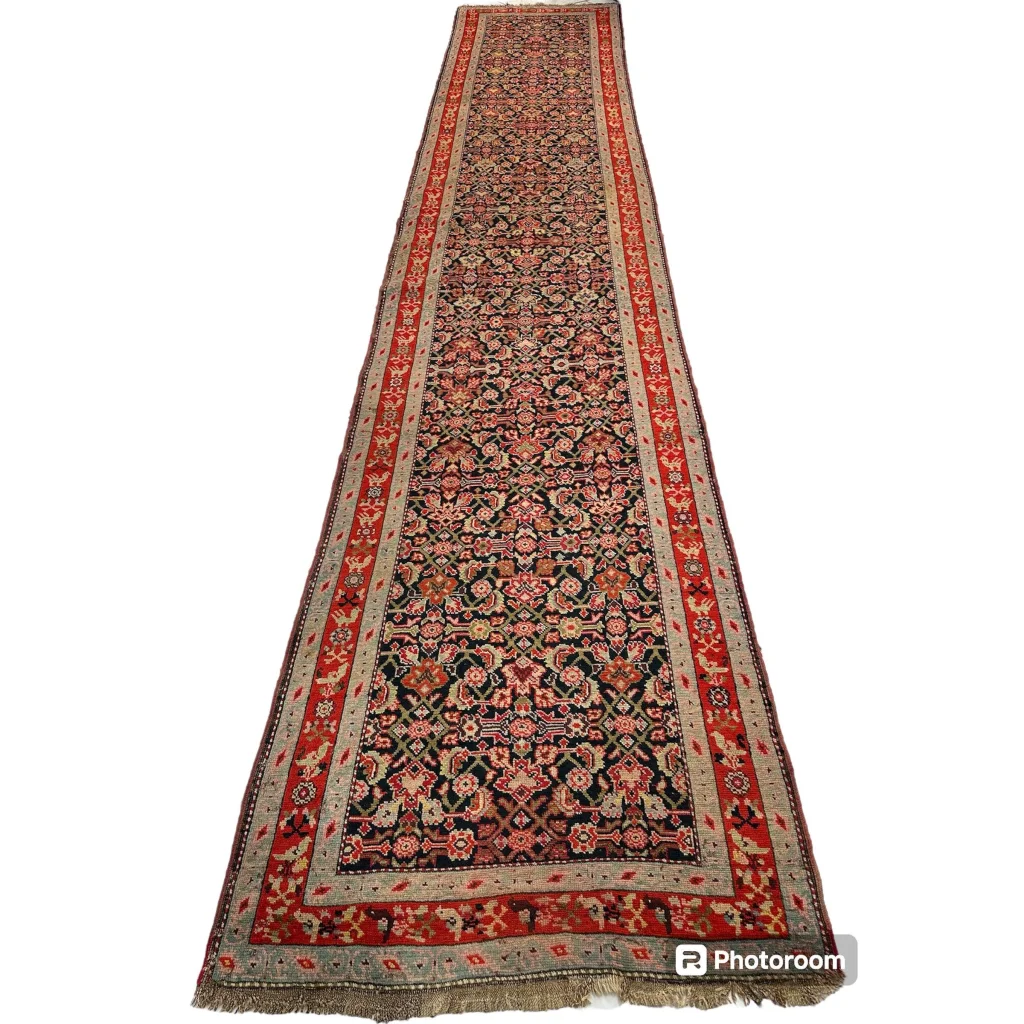 Stunning antique Caucasian wool runner rug with floral patterns