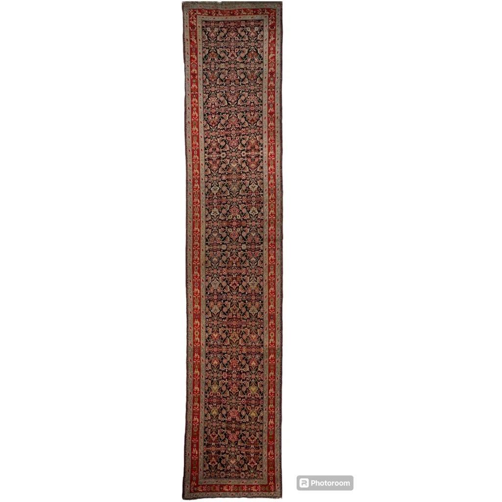 Stunning antique Caucasian wool runner rug in deep reds and florals