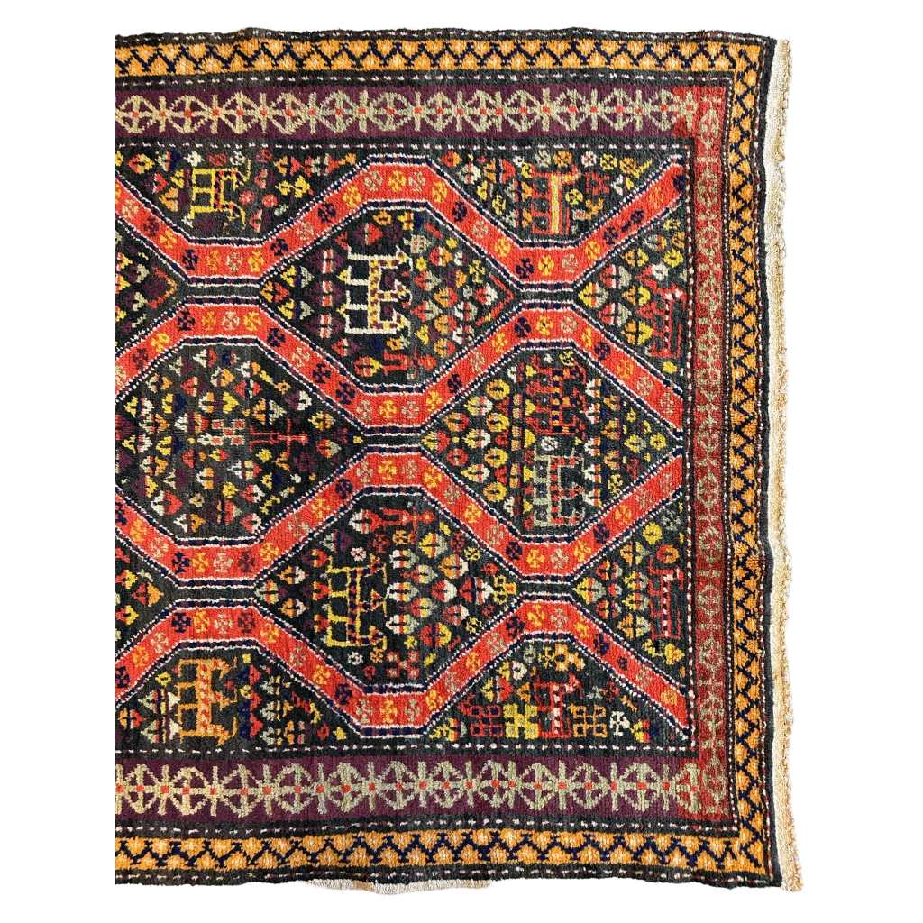 Antique Kazak rug 1910s Caucasus, close-up of bold geometric motifs in red and black natural dyes