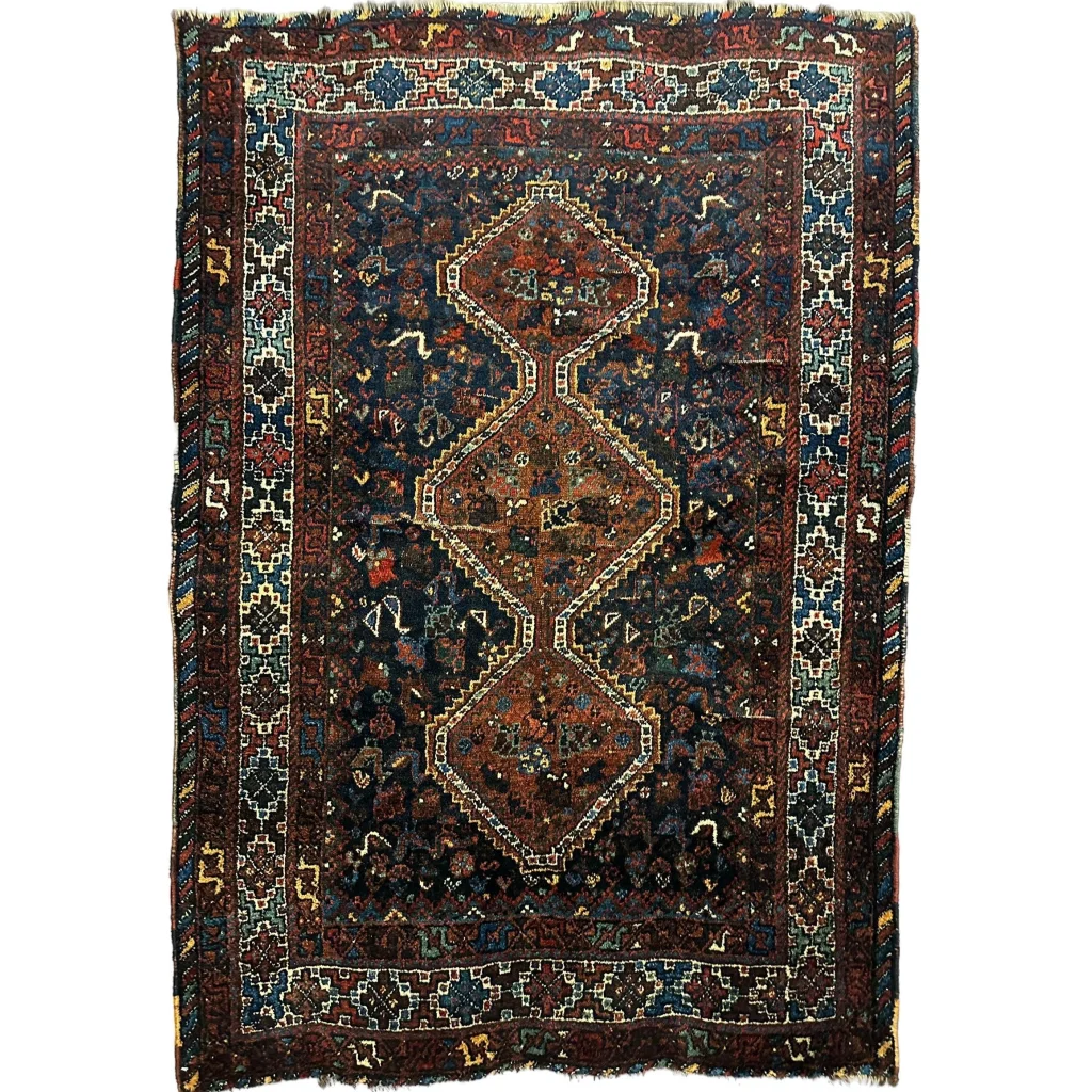 Antique 1920s Persian Khamseh tribal rug in dark blue and red geometric pattern