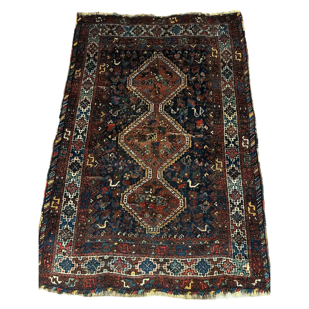 Antique 1920s Persian Khamseh tribal rug with dark brown and blue geometric patterns
