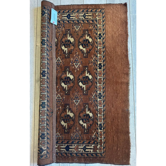 Stunning antique Tekke Yomud rug with brown woven geometric patterns in cream, black, and rust
