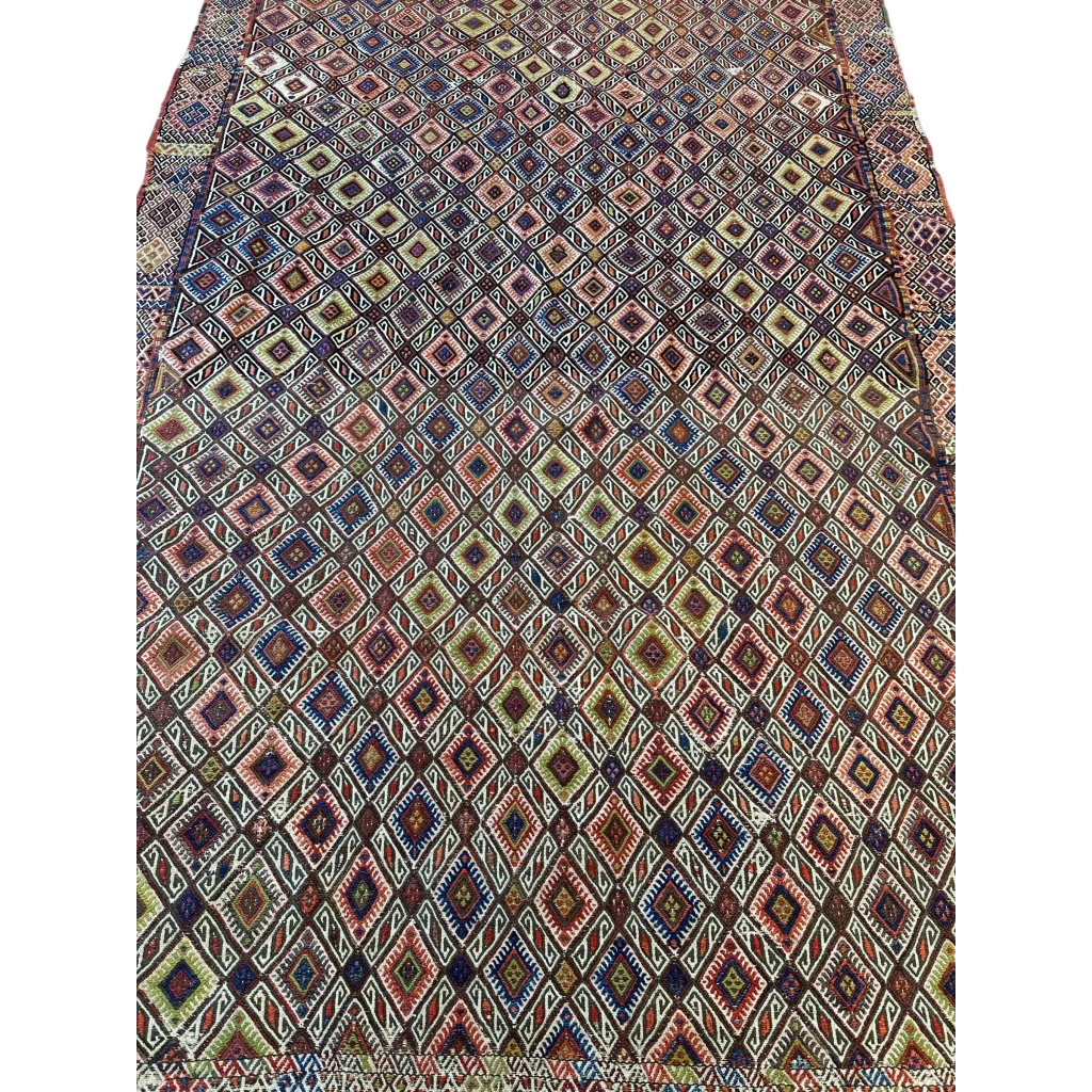 Vintage antique Turkish Jajim wool rug with diamond pattern in earth tones