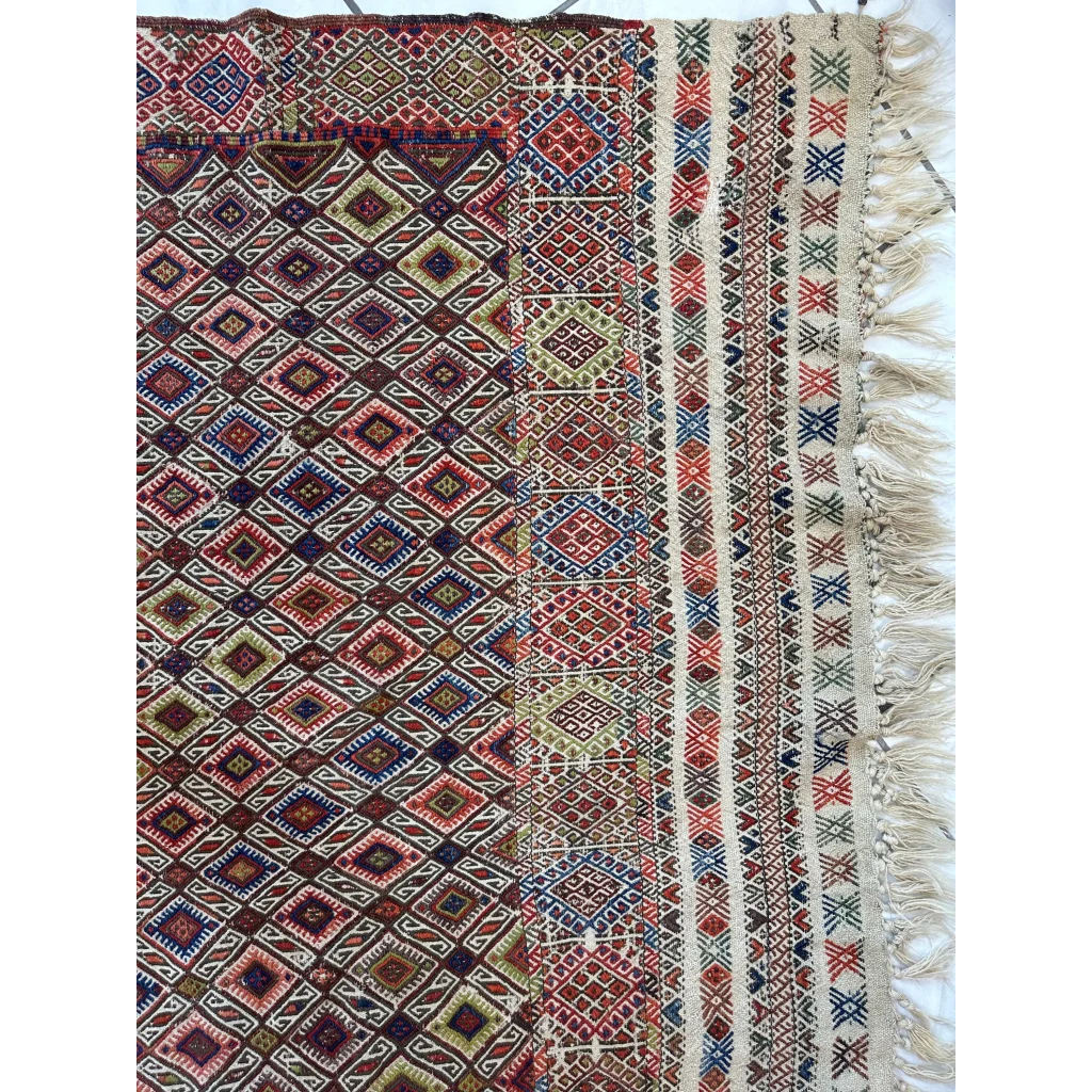 Stunning antique Turkish Jajim wool rug with geometric patterns in reds and blues