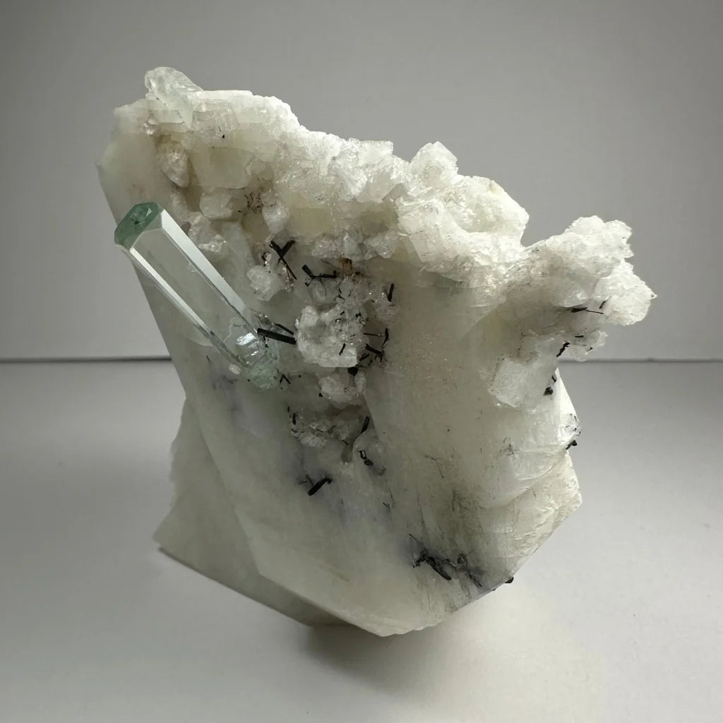 Stunning aquamarine beryl crystal with black tourmaline on albite