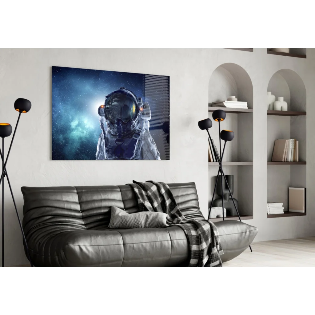 Stunning astronaut glass wall art with cosmic reflections on black leather couch
