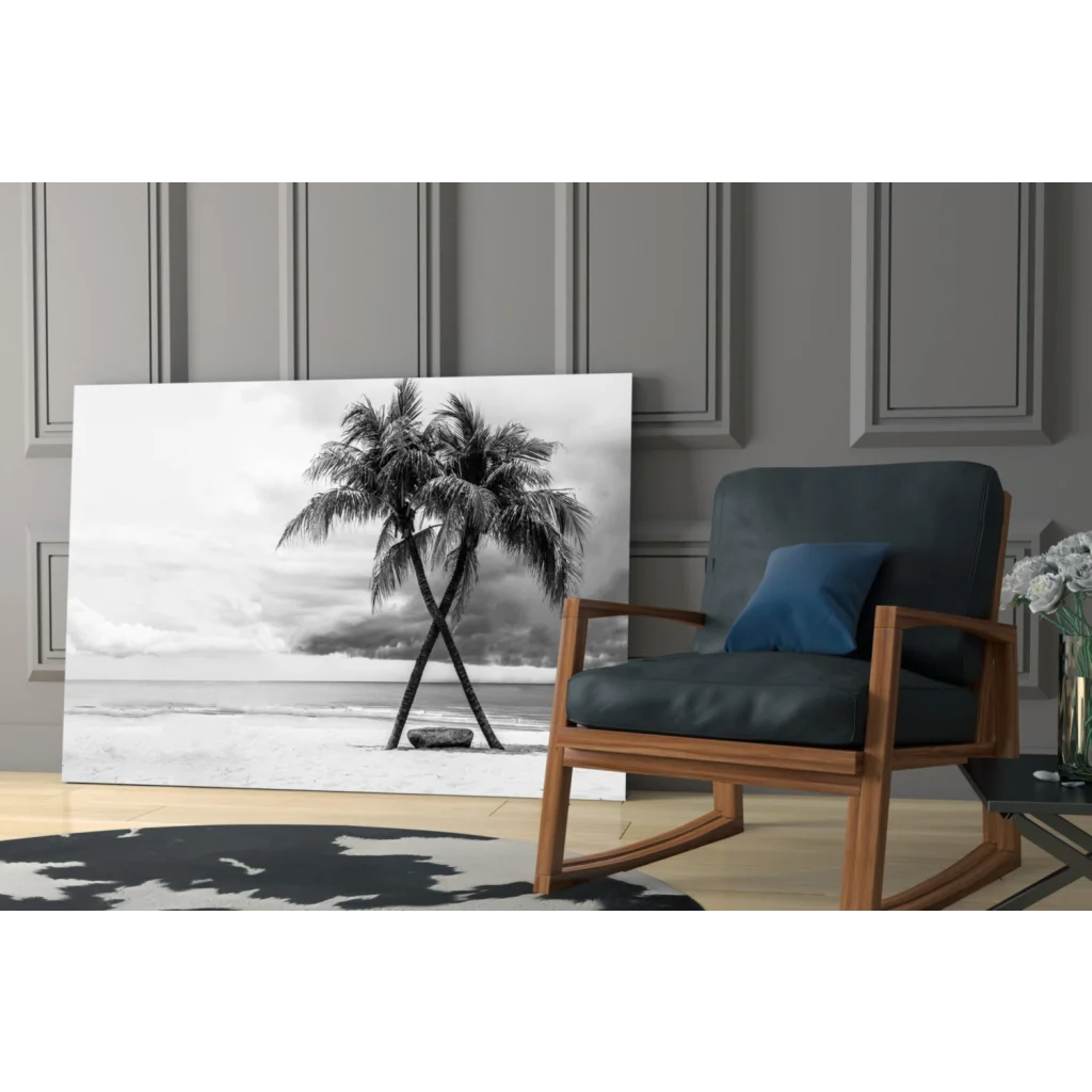 Black-and-white glass wall art of two palm trees on a beach