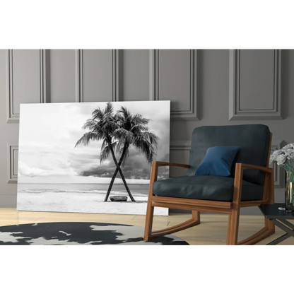 Black-and-white glass wall art of two palm trees on a beach