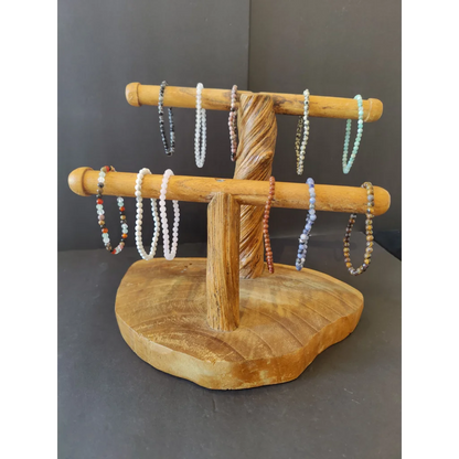 Natural wood stand with bars displaying beaded stone bracelet 4mm gems