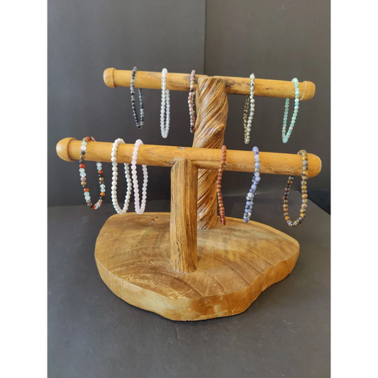 Natural wood stand with bars displaying beaded stone bracelet 4mm gems
