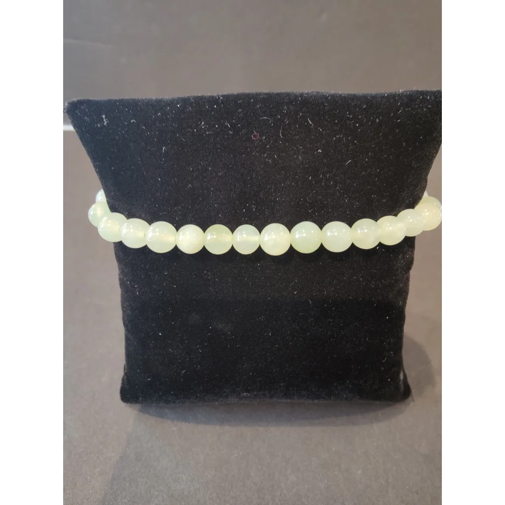Delicate pale green 6mm beaded stone bracelet of smooth natural gems