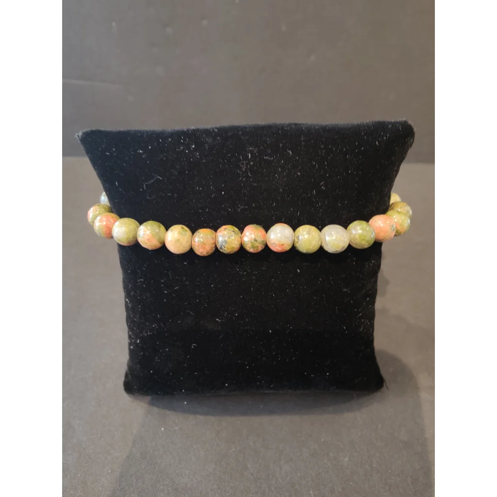 Stunning 6mm beaded stone bracelet with peachy-orange and olive-green gems
