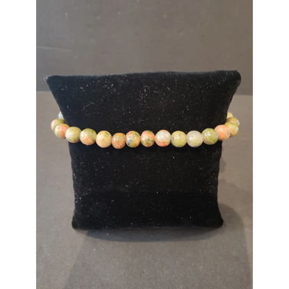 Stunning 6mm beaded stone bracelet with peachy-orange and olive-green gems