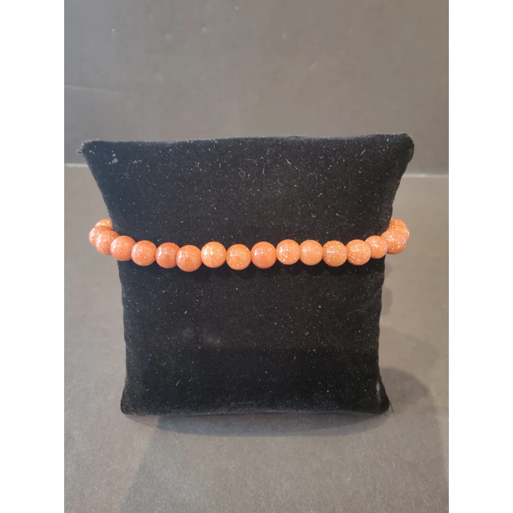 Stunning 6mm orange sandstone beaded stone bracelet with glittery beads