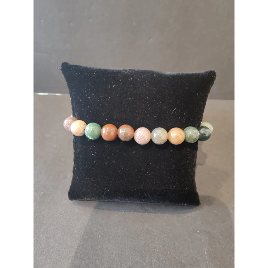 Colorful 8mm beaded stone bracelet in earthy green, orange, pink hues