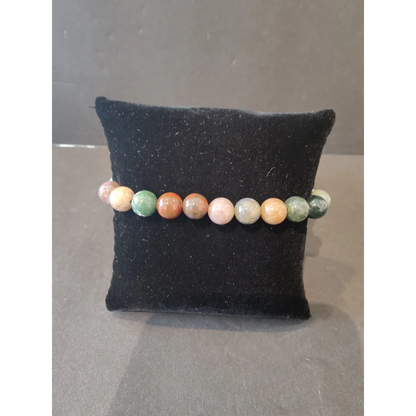 Colorful 8mm beaded stone bracelet in earthy green, orange, pink hues