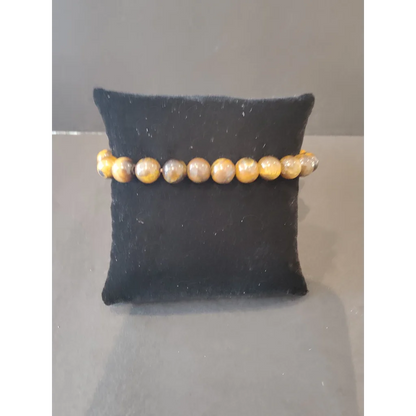 Stunning yellow and brown tiger eye beaded stone bracelet with 8mm beads on black velvet