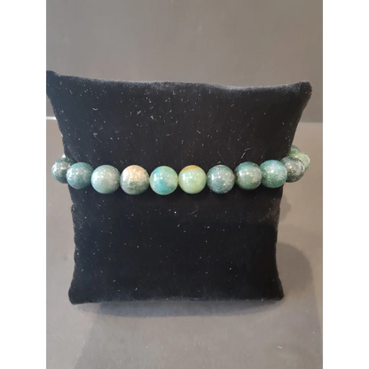 Stunning turquoise green aventurine beaded stone bracelet on black velvet
