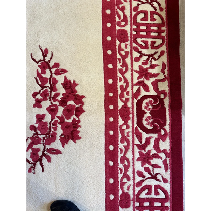 Hand-knotted Chinese Art Deco wool rug India, corner detail showing red floral motifs on beige ground