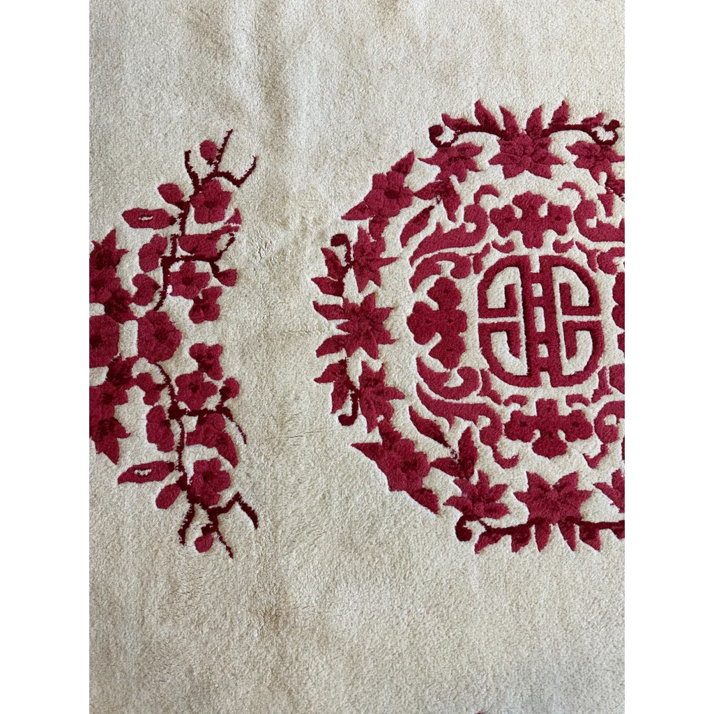 Cream ground Chinese Art Deco wool rug with red floral and cloud-band motifs, hand-knotted pile