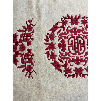 Cream ground Chinese Art Deco wool rug with red floral and cloud-band motifs, hand-knotted pile