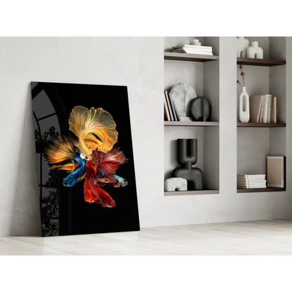 Vibrant betta fish glass wall art in gold and red on black background