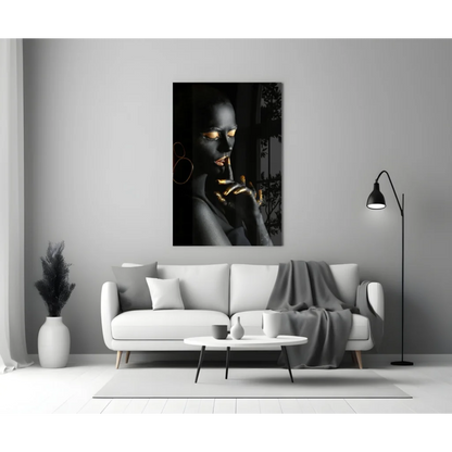 Black and gold portrait canvas wall art above white sofa