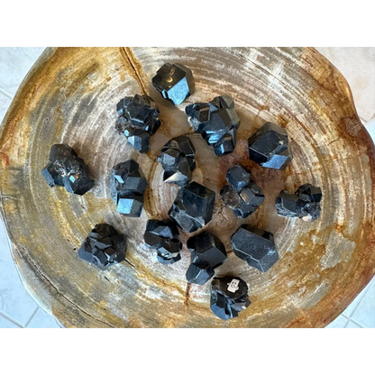Stunning black melanite garnet crystal from Mali Africa on wood
