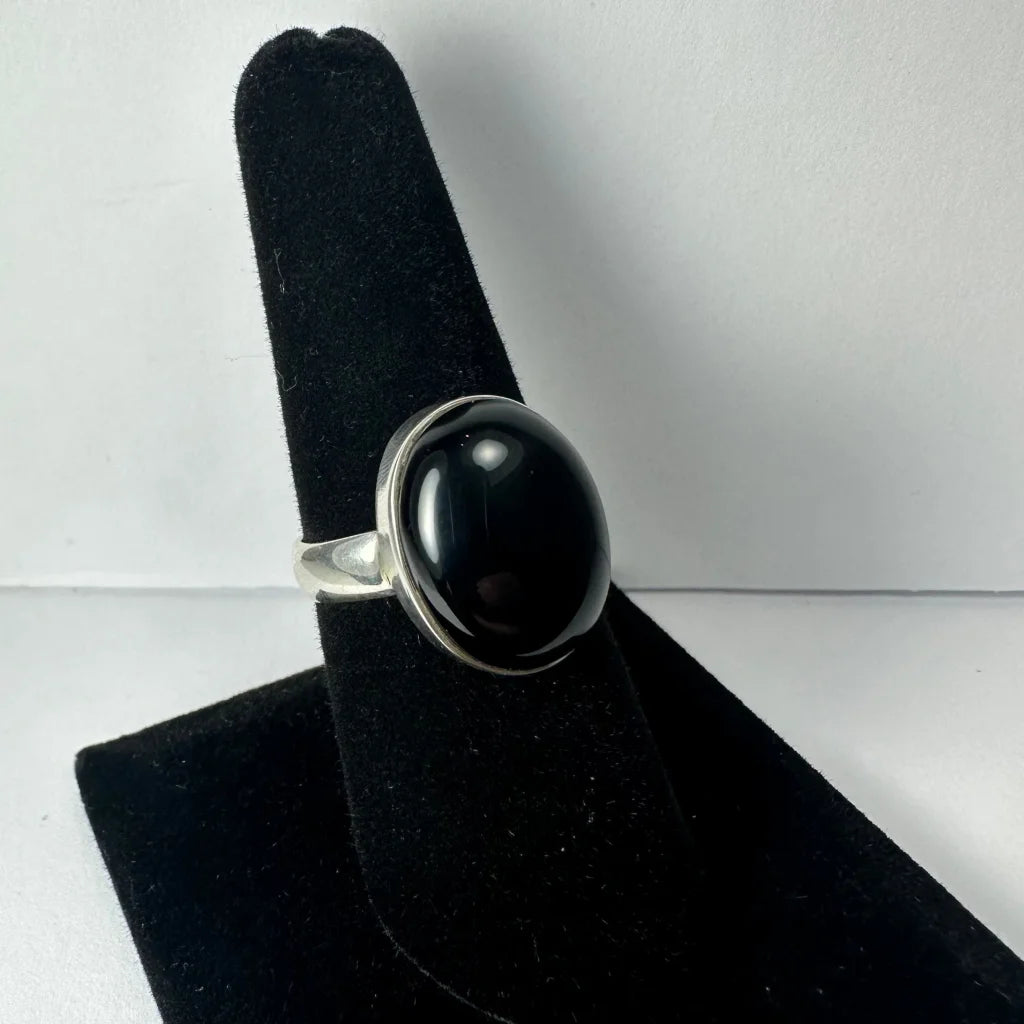 Elegant black onyx ring in sterling silver with oval bezel stone