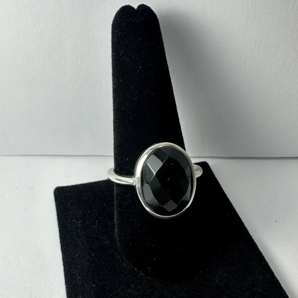 Sleek sterling silver black onyx ring with faceted oval stone