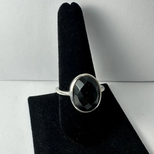 Sleek sterling silver black onyx ring with faceted oval stone