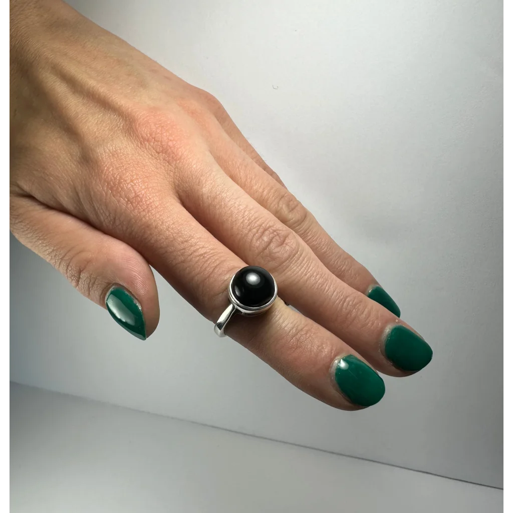 Sleek black onyx ring in sterling silver with smooth round stone