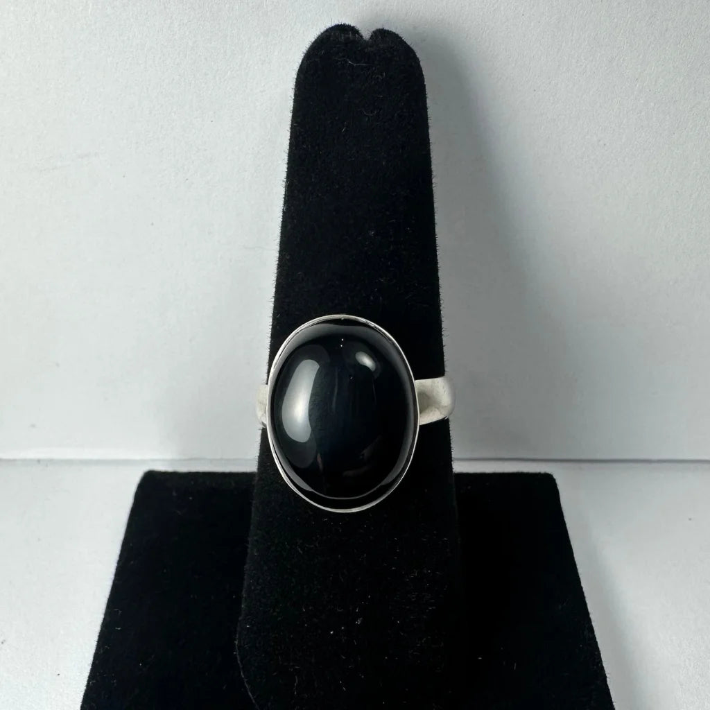 Sleek silver black onyx ring with oval stone in polished bezel