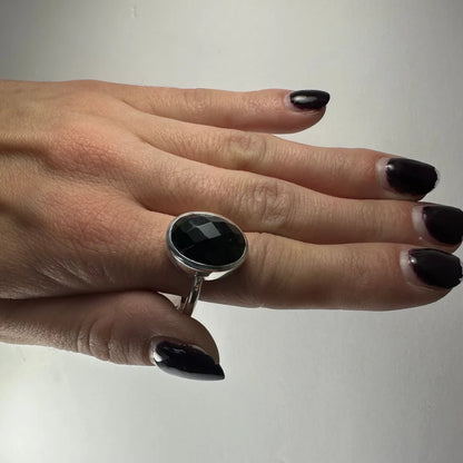 Sleek sterling silver black onyx ring with large faceted oval stone
