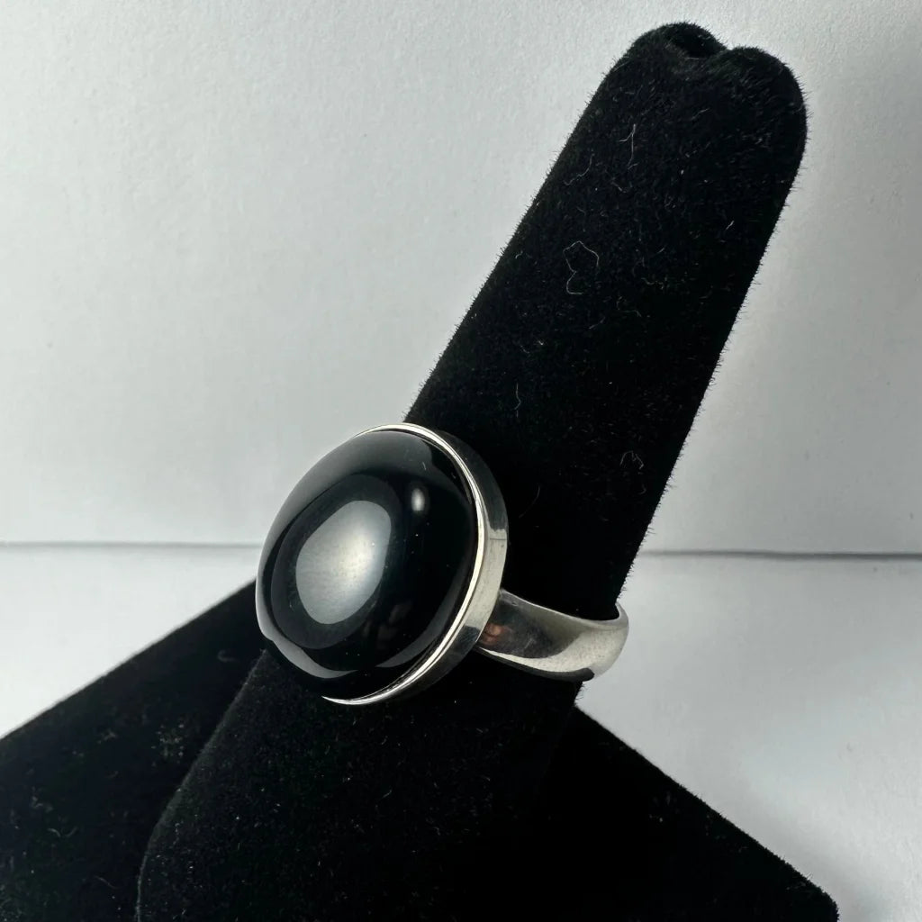 Sleek silver black onyx ring with oval stone in polished bezel