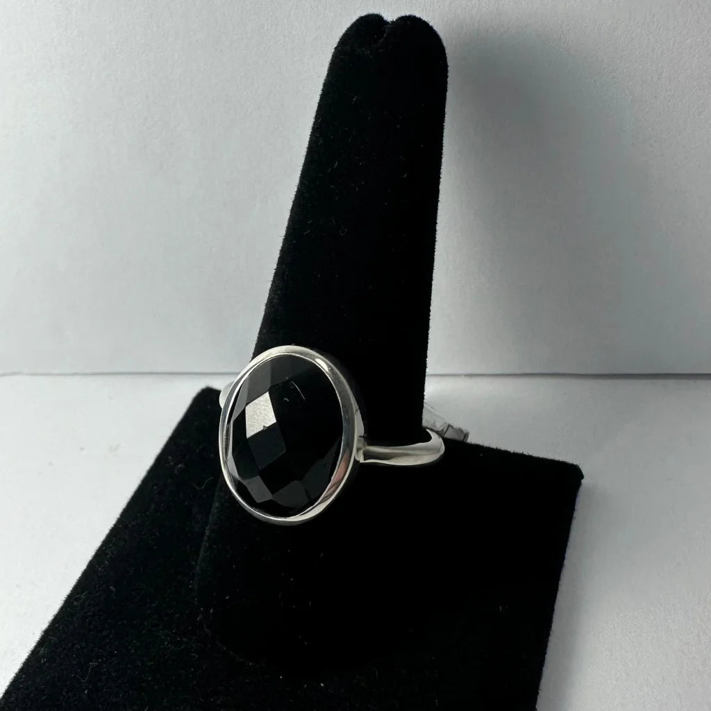 Sleek sterling silver black onyx ring with faceted oval stone