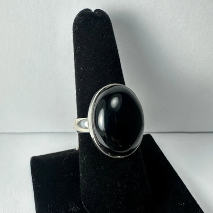 Sleek silver black onyx ring with oval bezel-set stone