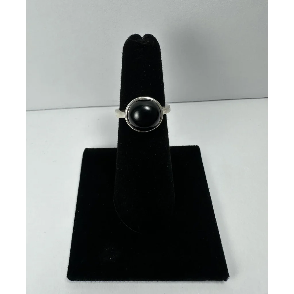 Stunning black onyx ring with smooth round stone in sterling silver bezel