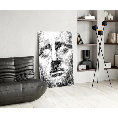 Modern black leather couch with abstract face wall art canvas print