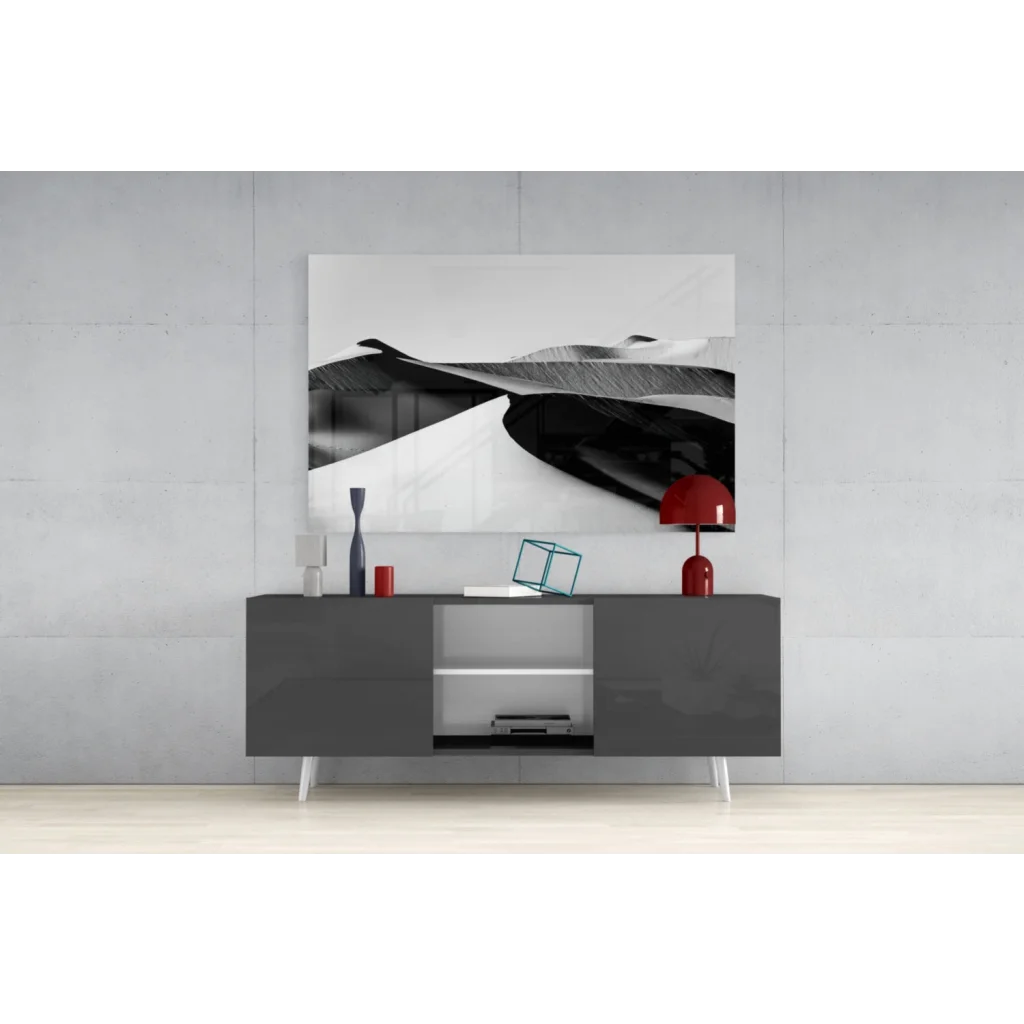 Modern gray lacquered sideboard with white legs under stunning black and white wall art