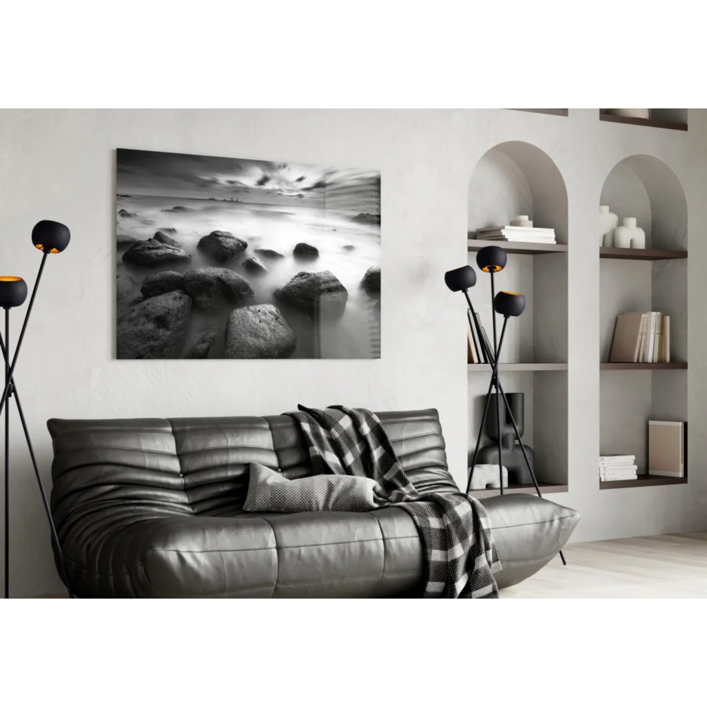 Stunning black leather sofa with textured pattern and plaid throw