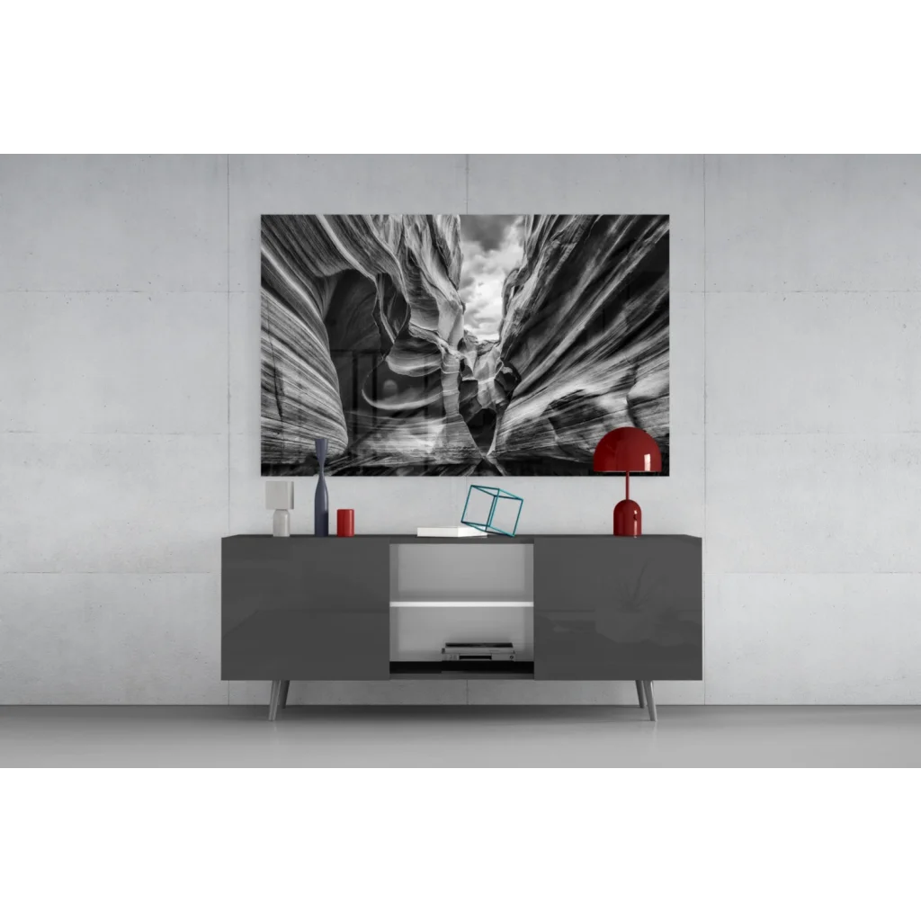 Modern gray sideboard with sleek silver legs under black and white canyon wall art