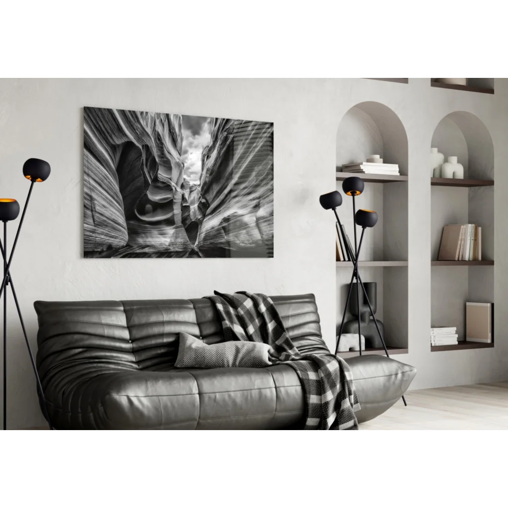 Black leather couch with canyon wall art print