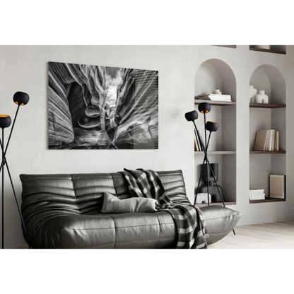 Black leather couch with canyon wall art print