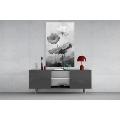 Modern gray lacquered sideboard with silver accents under floral wall art