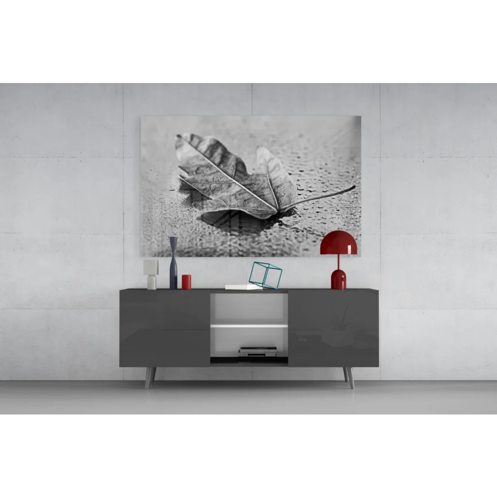Modern gray sideboard with sleek silver accents under Maple Leaf wall art